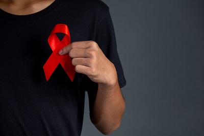 Men holding red ribbons. Conceptual awareness. HIV. World AIDS D